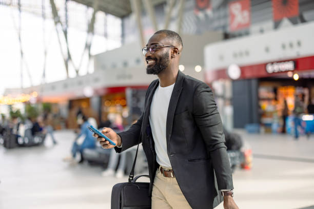 Nigerian traveler enjoying a beach in Barbados, a top visa-free country in 2026
